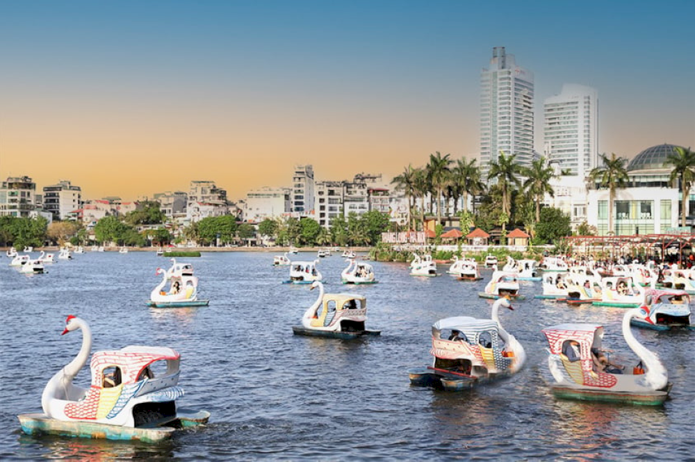 Pedaling on Truc Bach Lake is a pleasure for visitors of all ages